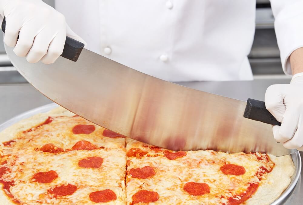 pizza is cut with rocker blade