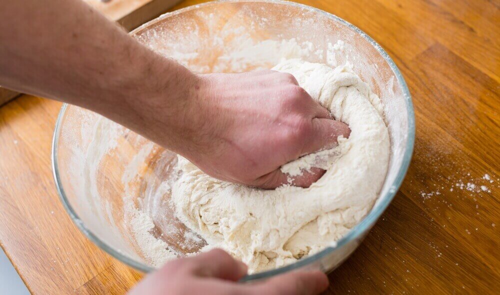 kneading dough for pizza