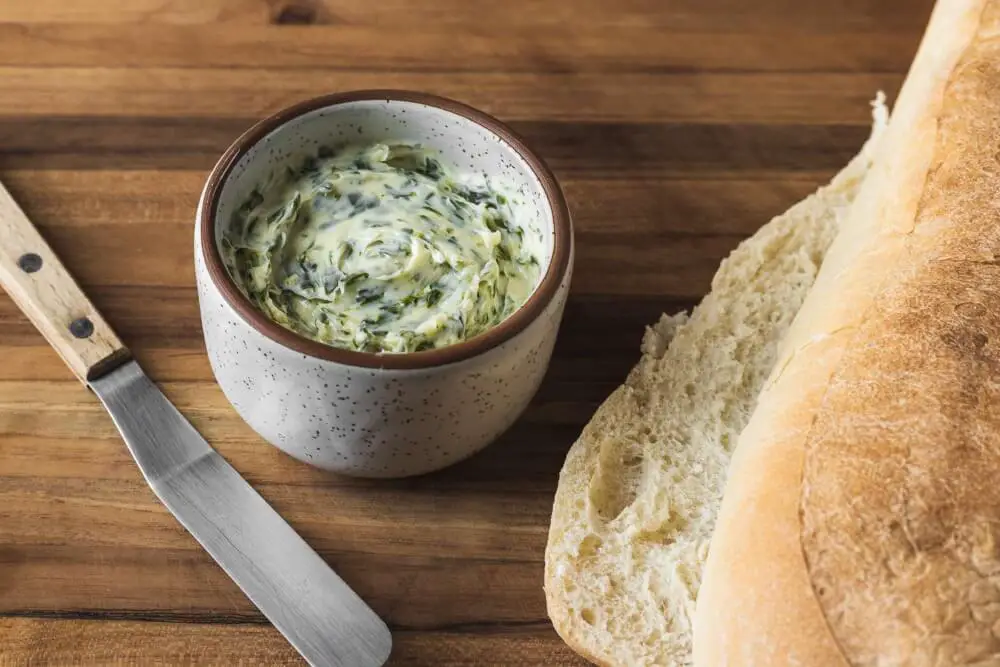 Cut the loaf lengthwise and spread the garlic butter