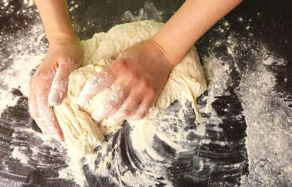 Kneading Pizza Dough on a Work Surface