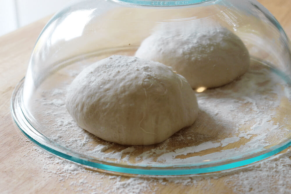 pizza dough covered to rest