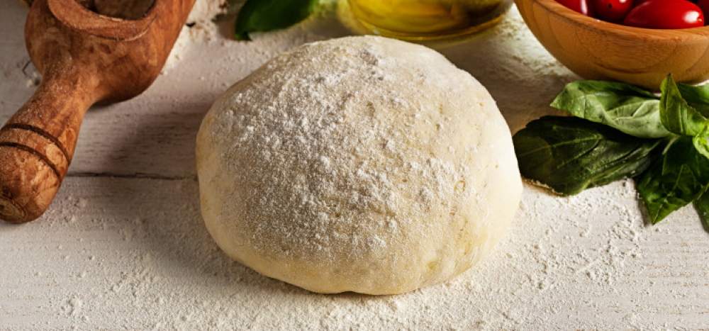 Ball of dough on a floured table